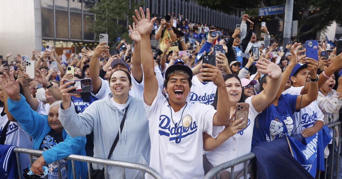 From far away, an L.A. couple grapples with all-too-familiar debate after Dodgers win