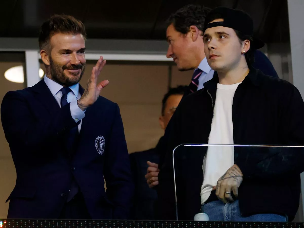 Brooklyn Beckham's brutal reaction after his dad David is finally knighted