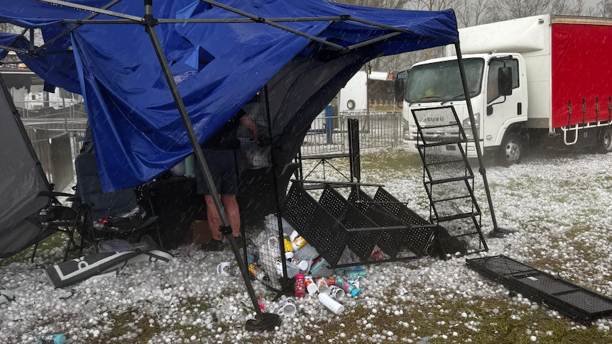 'Terrifying': Woman concussed after giant hail tore through school fair