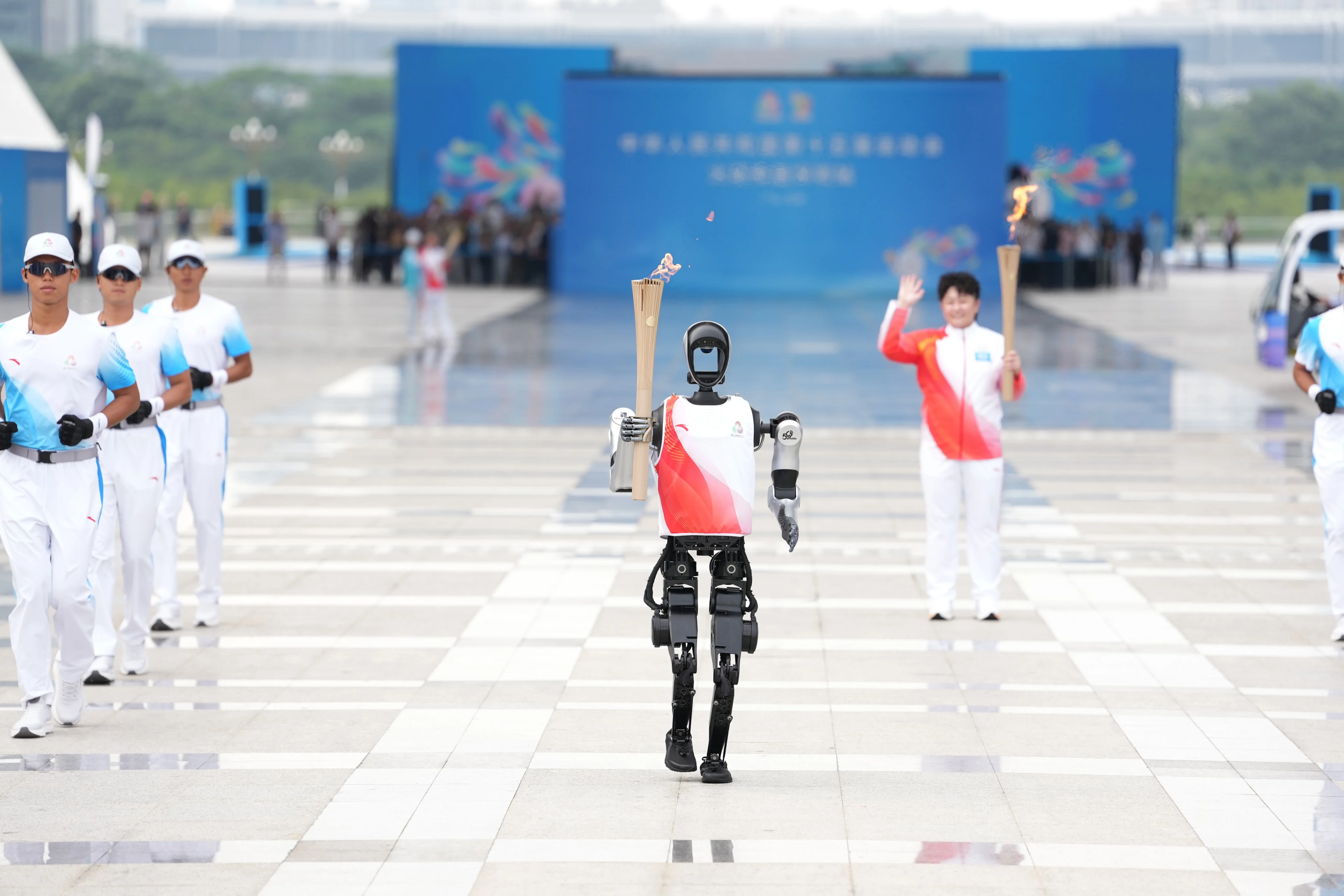 Chariots of wire: China flexes humanoid robot muscle at National Games with torch relay