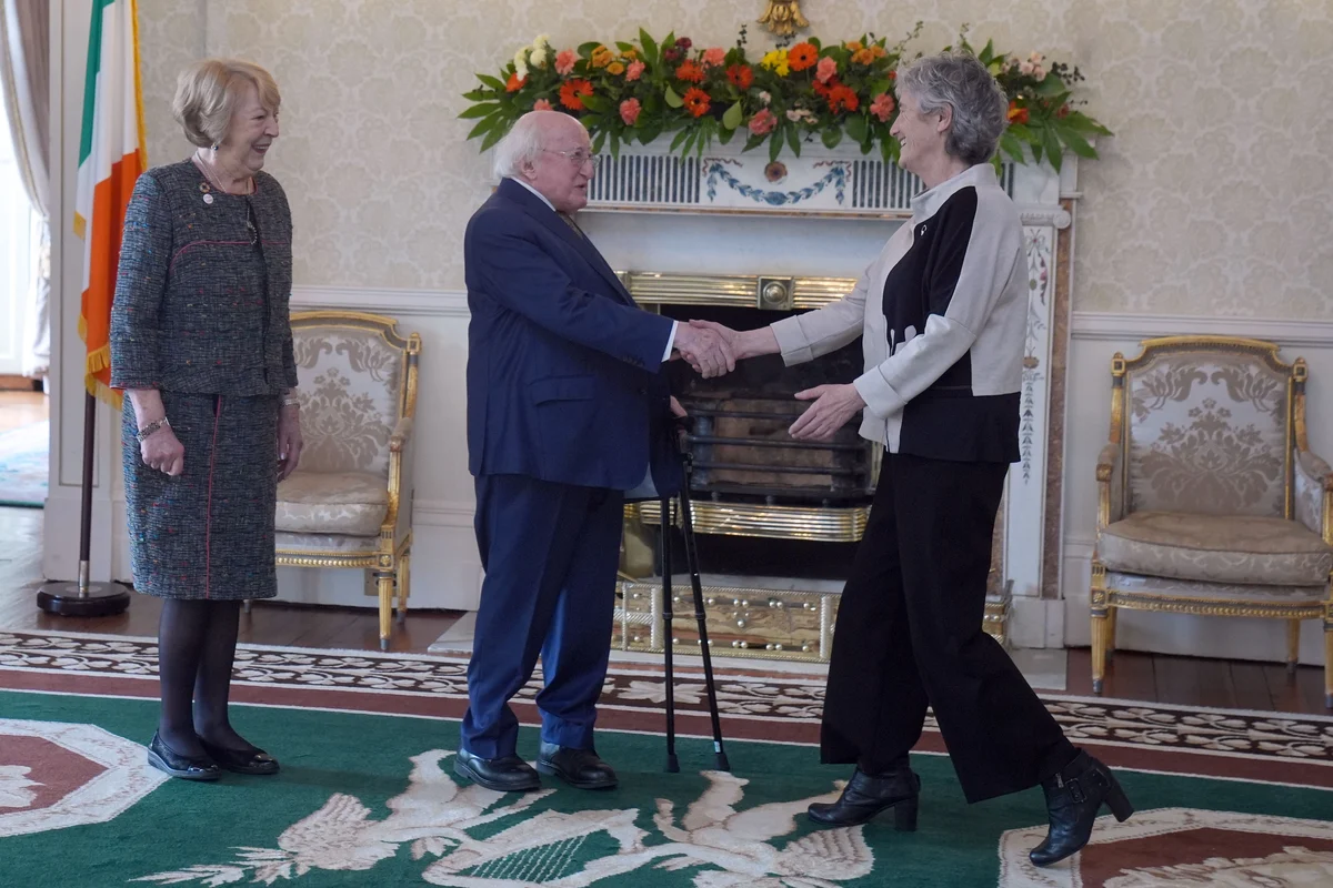 Hugs and handshakes as Ireland’s President welcomes his successor