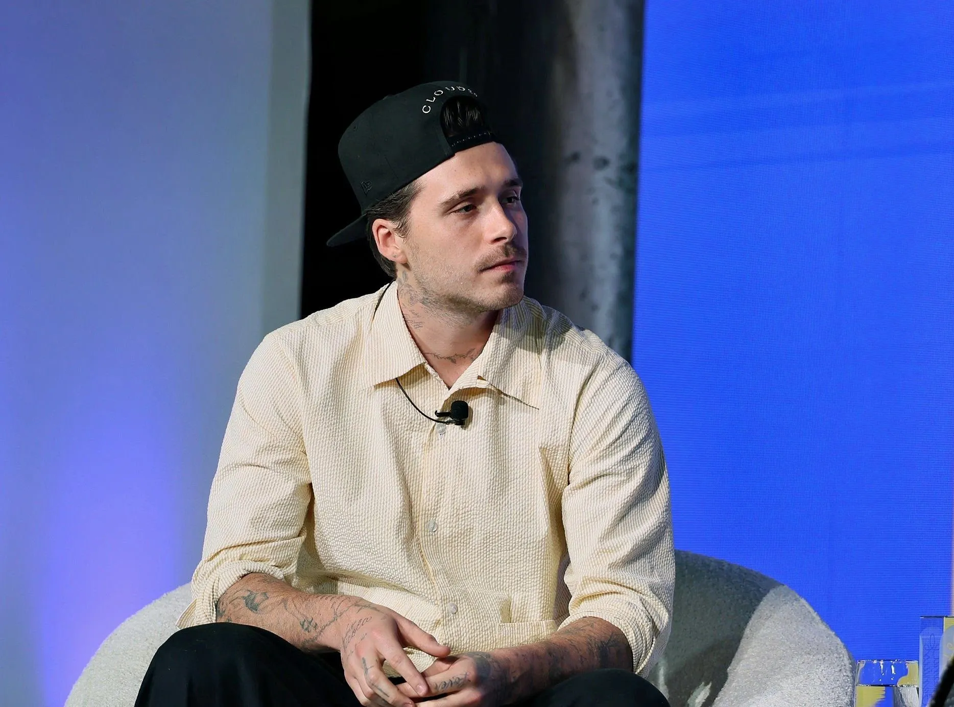 Brooklyn Beckham flooded with fan warnings after missing dad David’s knighthood