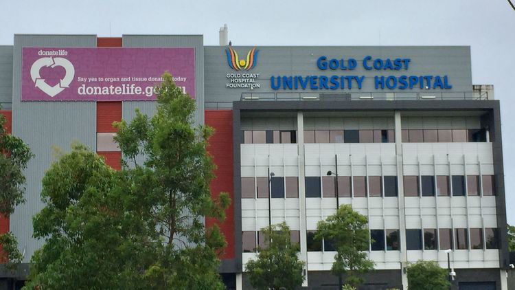 Pair on the run after Gold Coast teen stabbed on doorstep over 'debt'