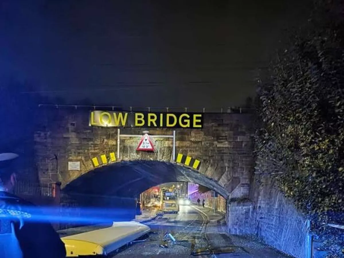 Roof ripped off bus as it hits low bridge in Greater Manchester town