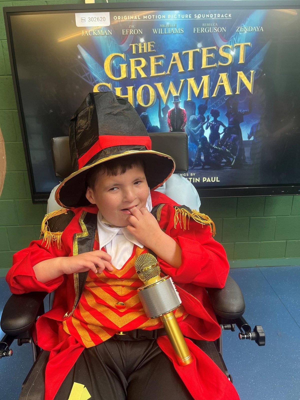Disabled and non-verbal Belfast boy, 11, up for national award after playing Greatest Showman in school play