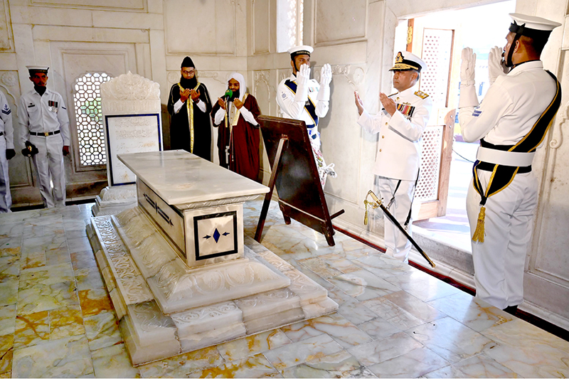 Commander Central Punjab, Rear Admiral Sohail Ahmed Azmie offering Fateha after laying floral wreath during change of guard ceremony to pay homage to the national poet, Allama Muhammad Iqbal on his 148th birthday anniversary at Mazar-e-Iqbal