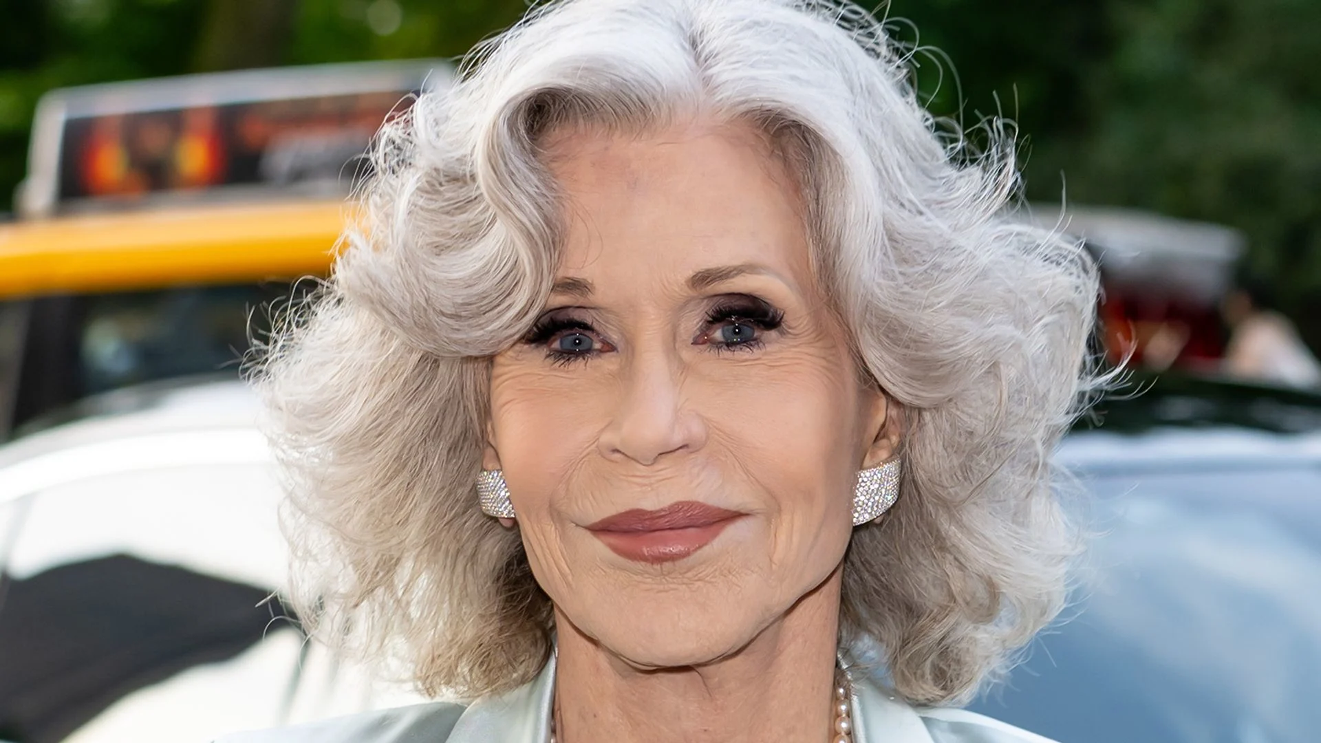 Jane Fonda, 87, looks incredible in fire red pantsuit during celebratory night out with Jamie Lee Curtis