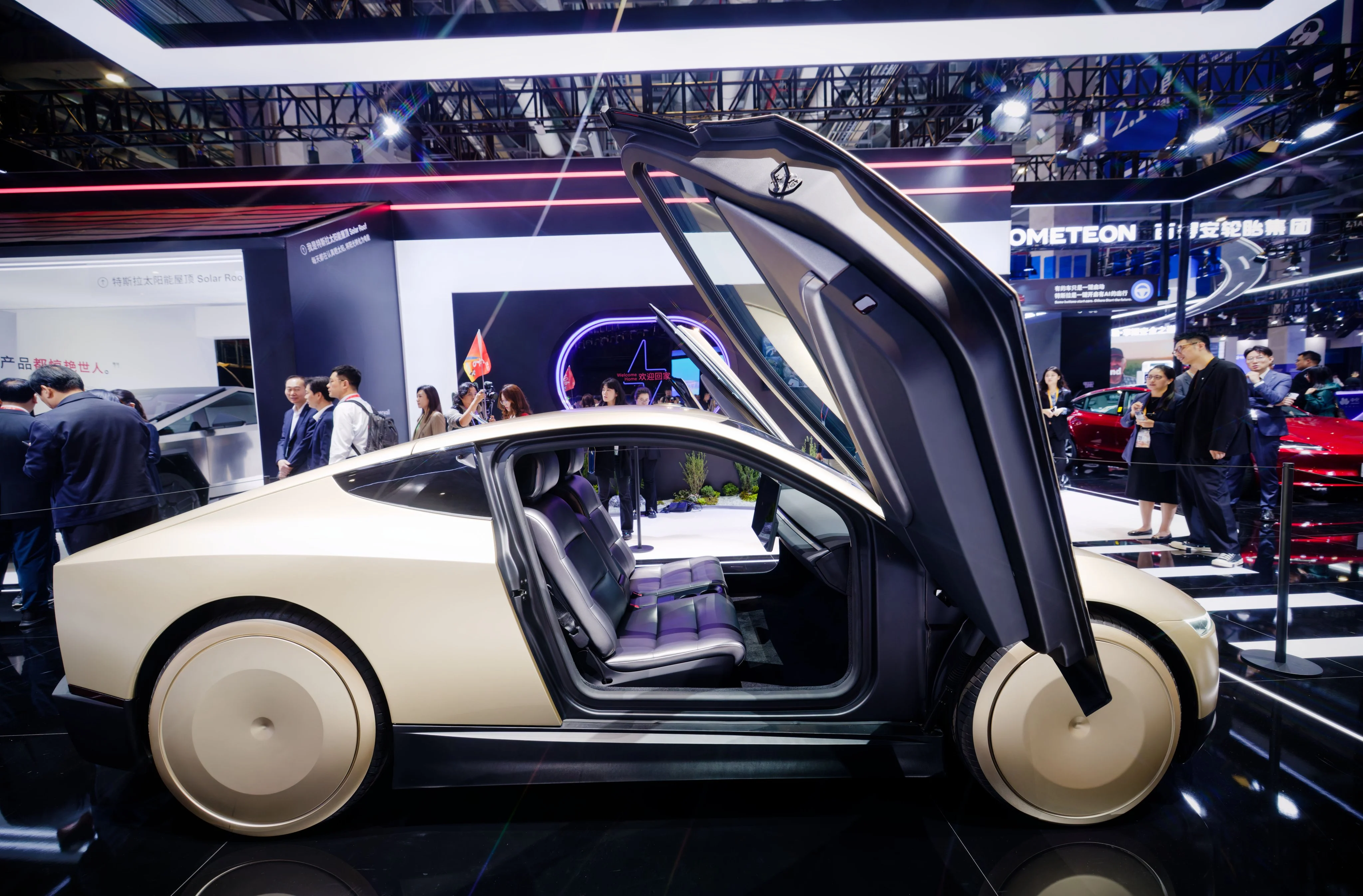 Tesla and global carmakers race against Chinese EV rivals at expo