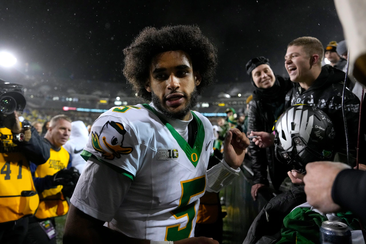The rain let up, but Dante Moore didn’t. And the Ducks CFP hopes are still very much alive. | Bill Oram