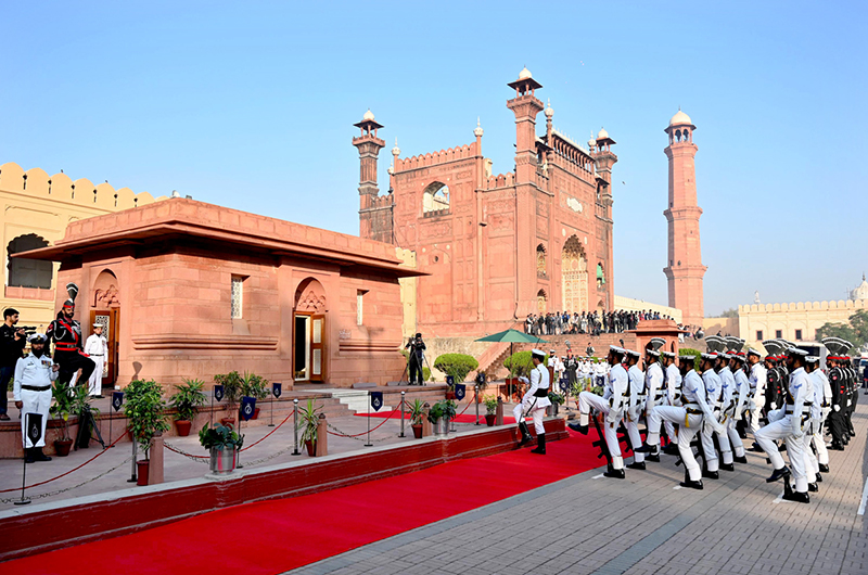 Pakistan Navy and Pakistan Rangers during change of guard ceremony to pay homage to the national poet Dr. Allama Muhammad Iqbal on his 148th birthday anniversary at Mazar-e-Iqbal