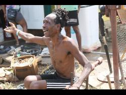 Man says floodwaters swept him from his bed