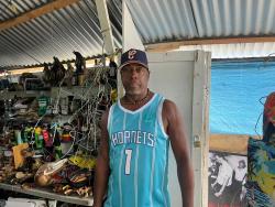 Street chef Bully Cat feeding Ocho Rios  - Businessman serving tasty meals to hurricane victims