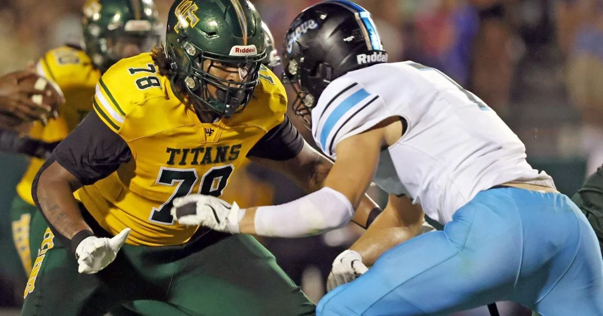 Keith Foster Jr. helps the West Forsyth football team move